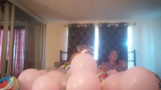 Miniatura filmu Milf with extreme long hair popping balloons and smoking cigarettes while filming up her own skirt